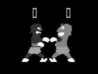 A screenshot of an old arcade game, black, white and grey, with two boxers facing each other. one has a dark pixel skin, the other has a medium tone.